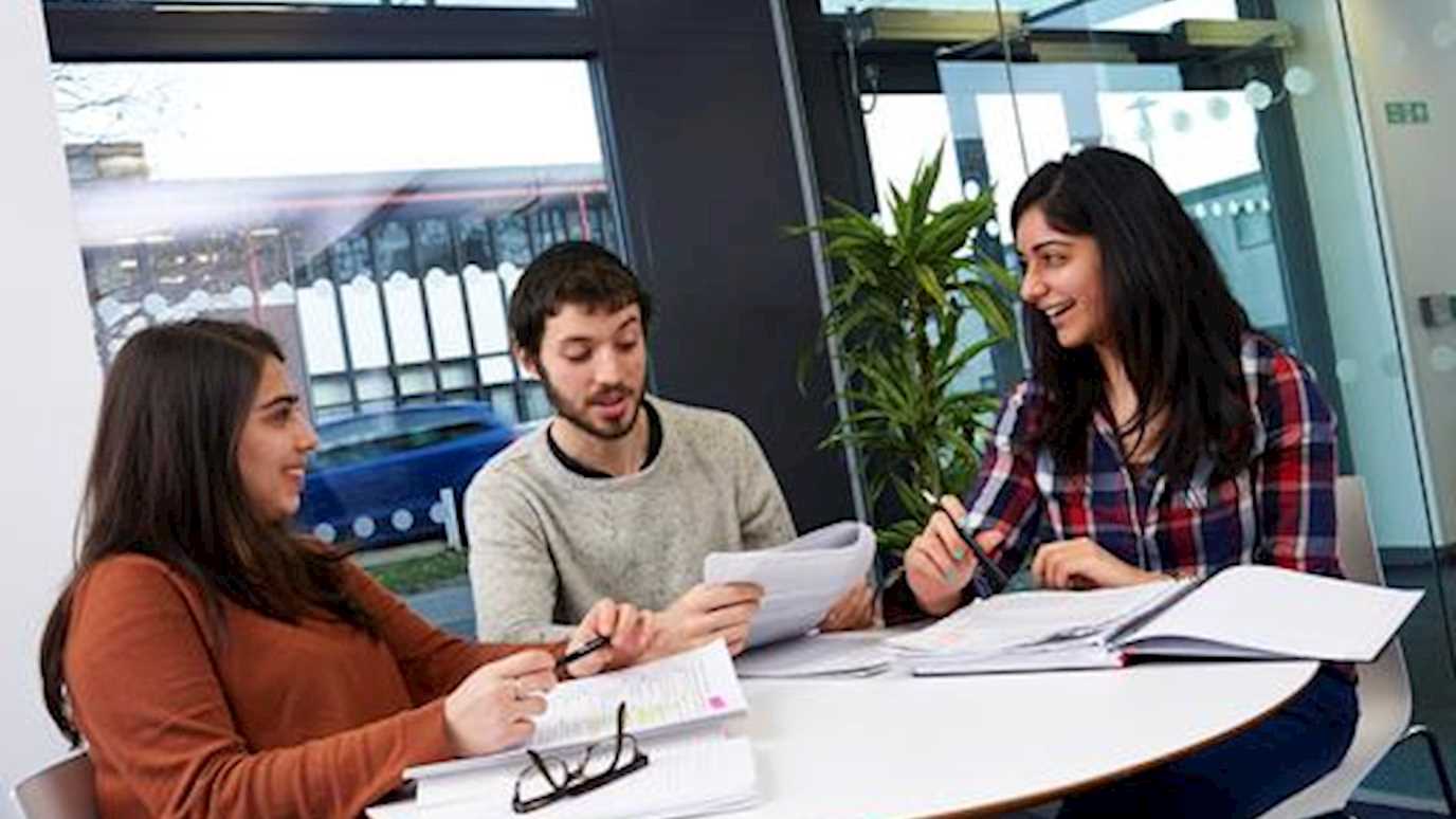 students round a table working - fees and funding (Mature students bursary)