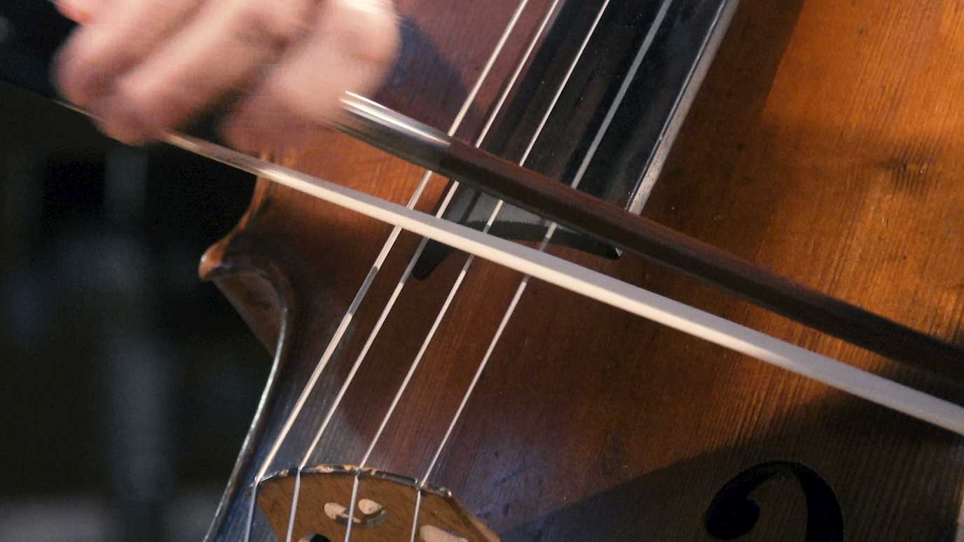 cellist-plays-bow-cello-closeup-089921940_prevstill.jpeg