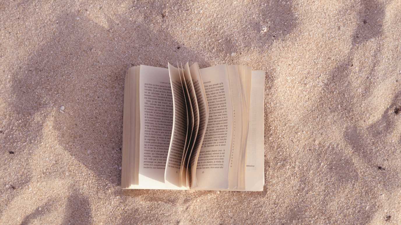 Book on sand - English