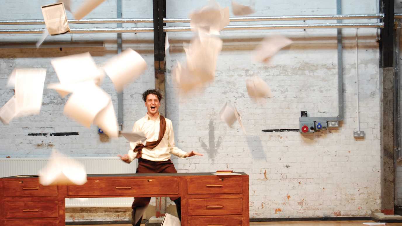 Man throwing papers in the air, Creative Writing - English