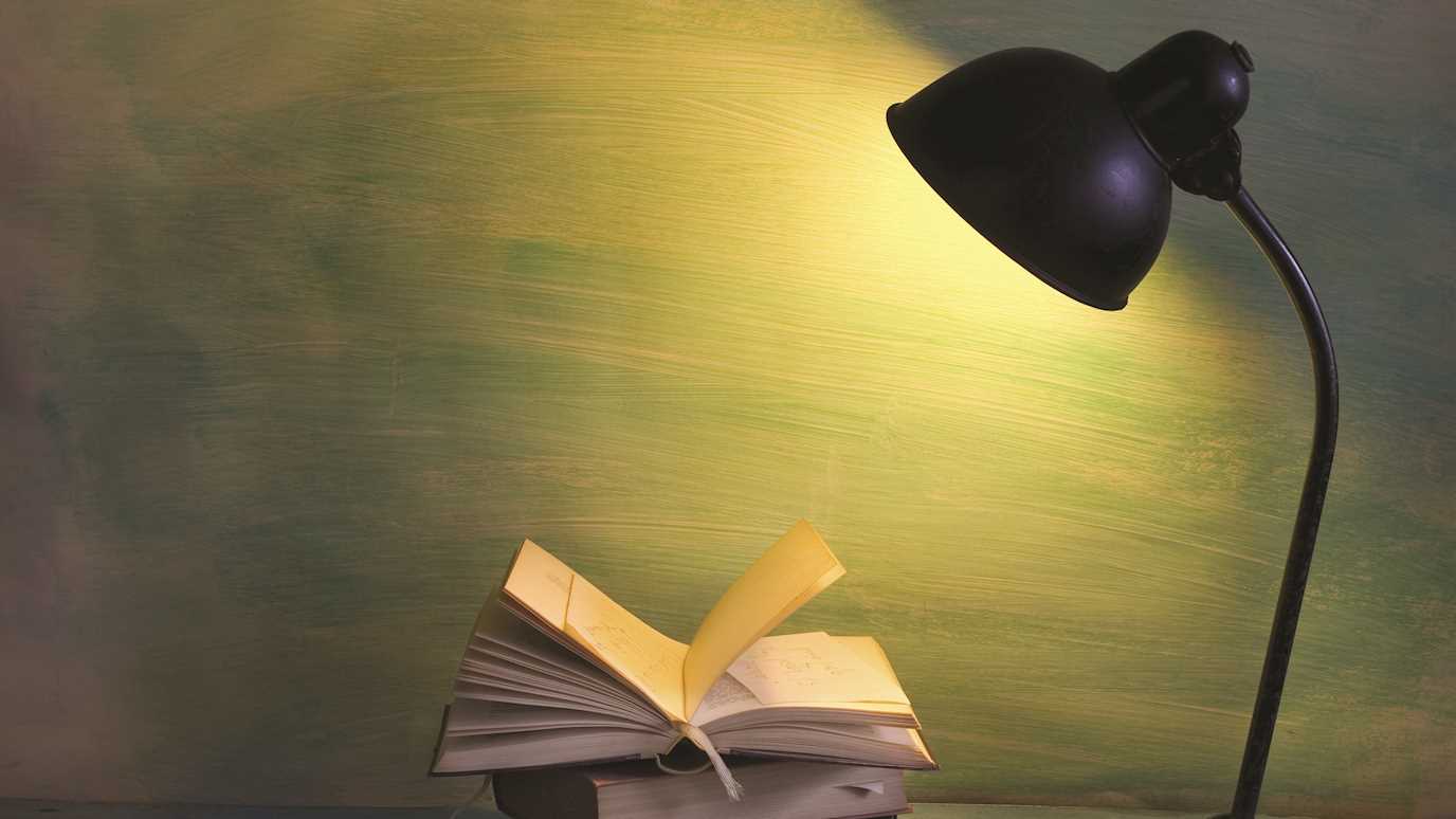 Books under a lamp - English