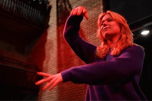 Woman performing in a dramatic pose