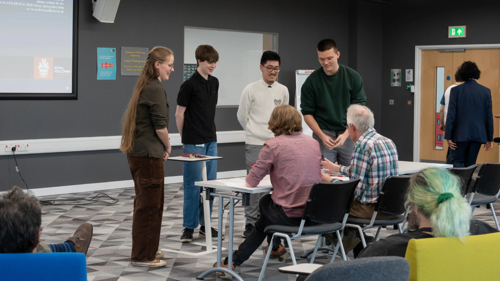 Student team presenting their idea to the industry panel during the showcase event
