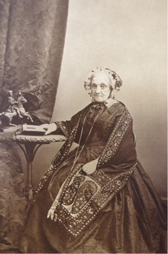 An old person sitting at a table

AI-generated content may be incorrect.